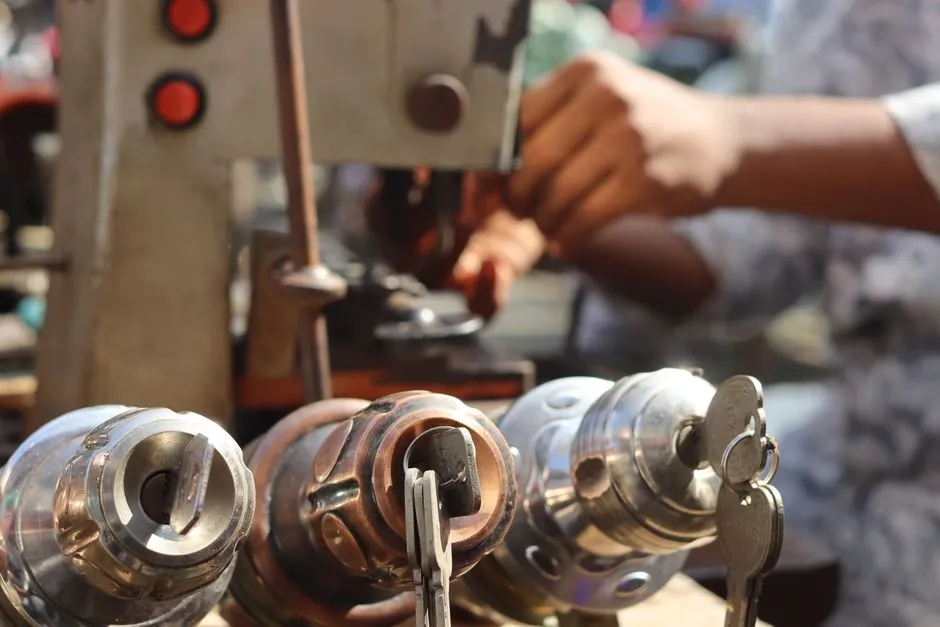 Locksmith working with tools on a lock mechanism